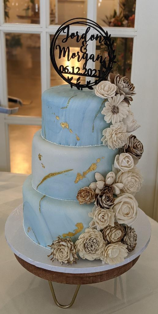 Blue and Gold Marbled Wedding Cake with Tumbling Flowers