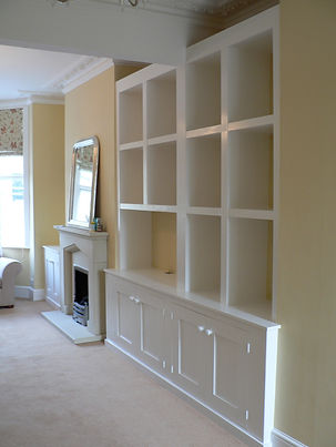 built-in chunky cubbyhole shelving unit with 4 door alcove cupboard at base