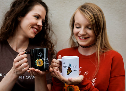 two women holding a customized design white glosy mug
