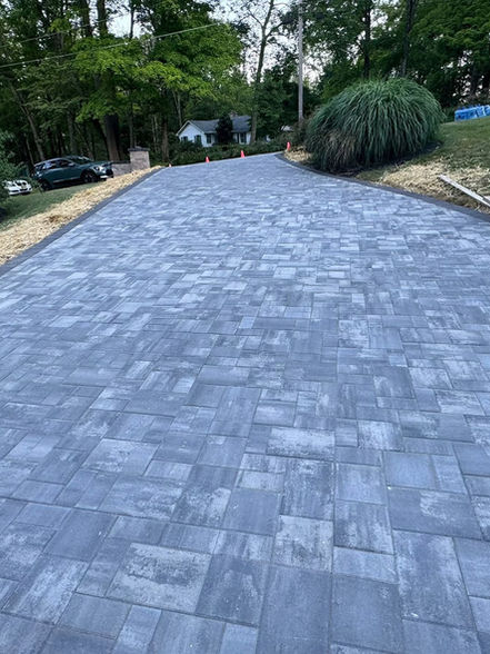 New gray paver driveway installation