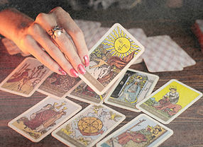 Tarot card of Waite in hand on dark backgroud_Say _Thanks_ via PayPal _)_edited.jpg