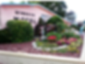 Windsor Hotel grounds with lobby and vintage motel sign