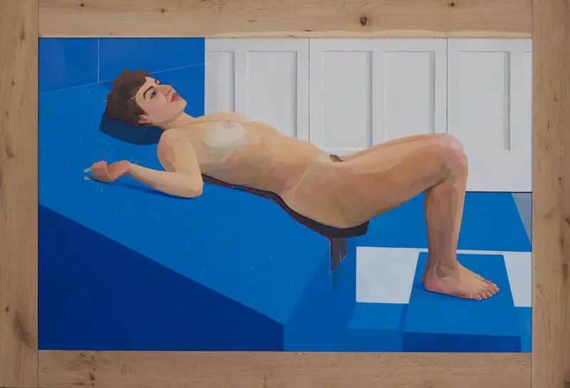 A full-length observational figure painting from life depicting a nude woman with short dark hair in a reclining position, looking upward and to the right. She rests her upper body on a large, multi-level geometric platform painted in shades of intense royal blue. Her knees are bent, with her left foot resting flat on a lower blue and white step structure. The upper background features a clean, white paneled wall or wainscoting. Precise alignment ticks and subtle measuring marks are visible across the blue surfaces, documenting the complex calculation of spatial intervals and foreshortening.