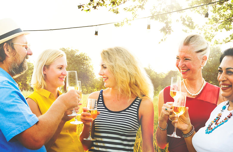 Group of Women and a man toasting with champagne