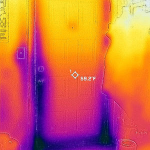 Thermal image scan of a kitchen door to the outside, showing drastic heat loss/cold air entry.