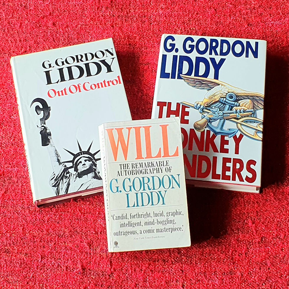 3 books spread out on a red background