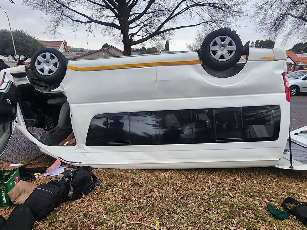 Overturned school taxi after high-speed crash on Westpark Road. Multiple children injured.