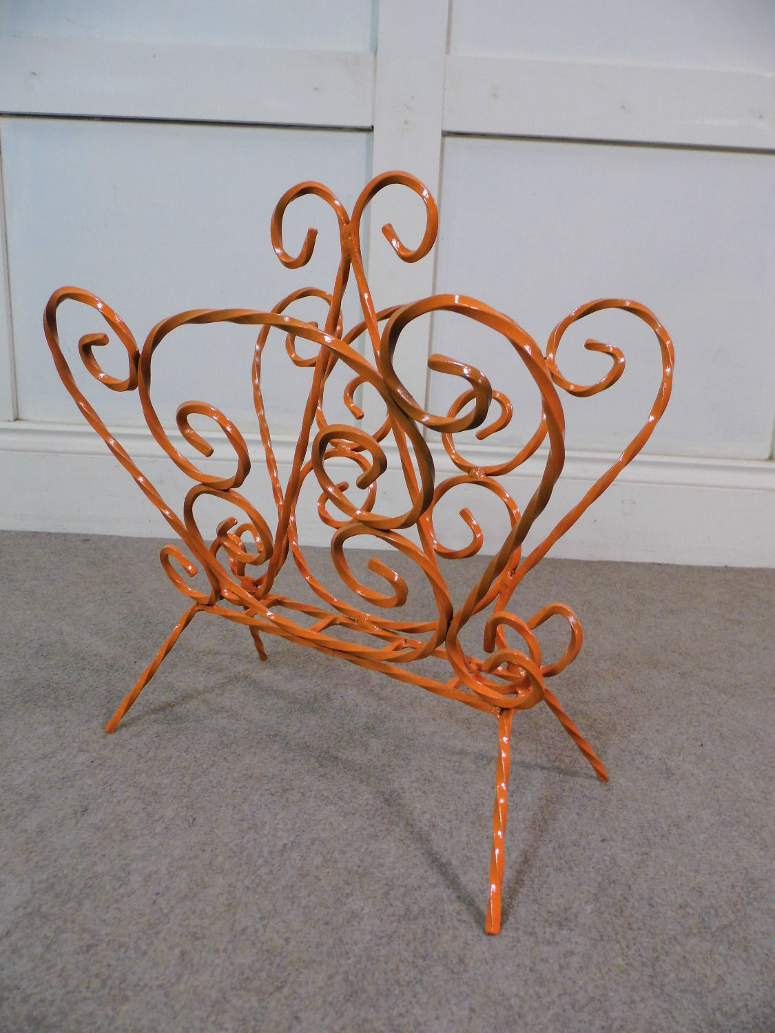 Vintage retro 1970s twisted metal magazine rack orange colour
