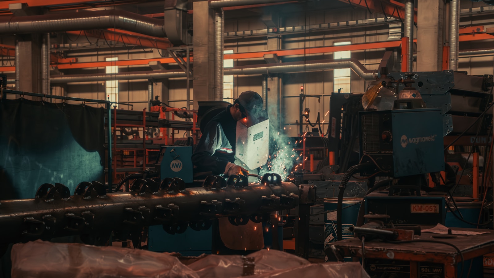 Industrial worker operating machinery in a realistic technical training environment