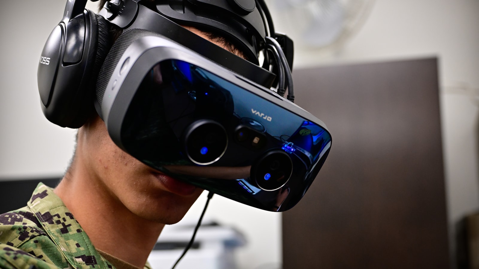 Participant wearing a virtual reality headset during a spatial training simulation