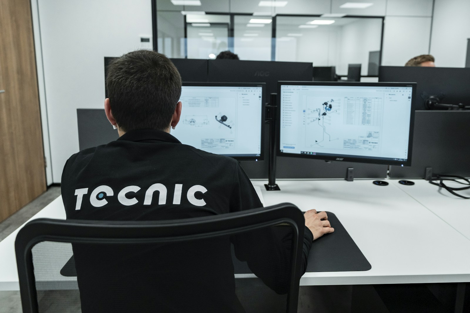 Engineer reviewing technical drawings while planning immersive training