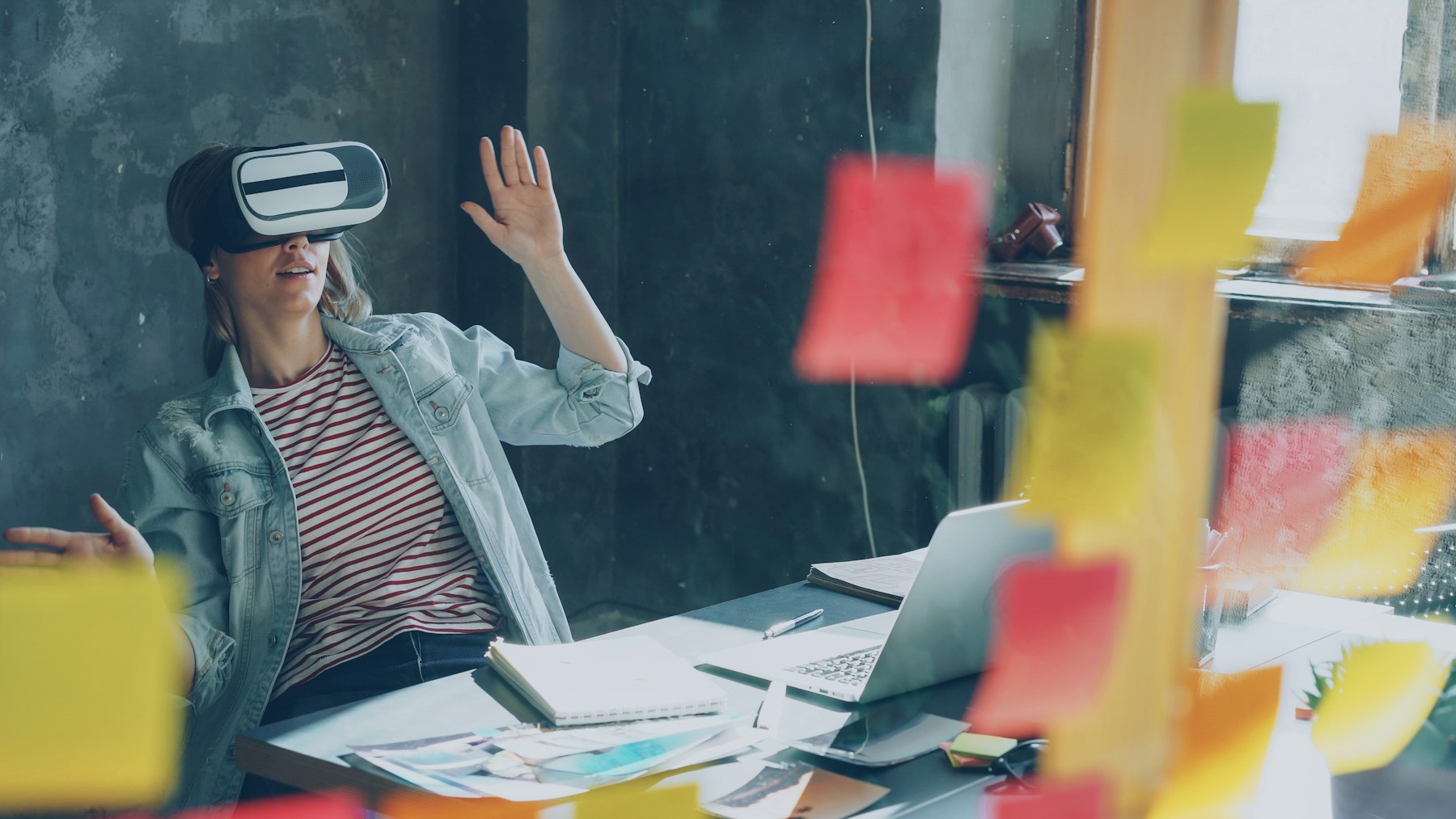 Office user interacting with a spatial computing headset