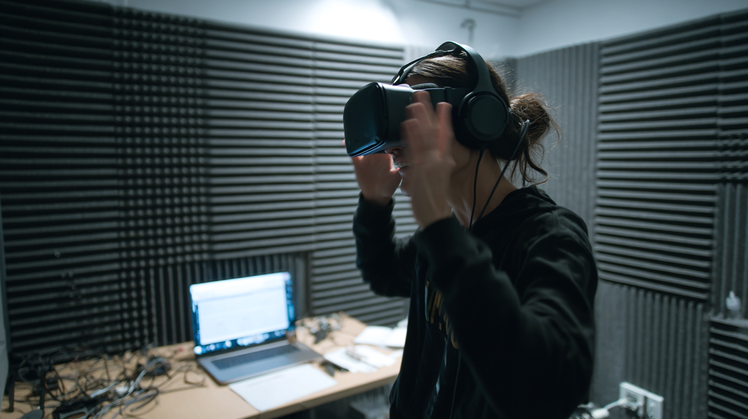 A trainee using a VR headset and spatial audio headphones in a real XR training room.