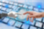 AI hand and human hand touching index fingers over a computer keyboard