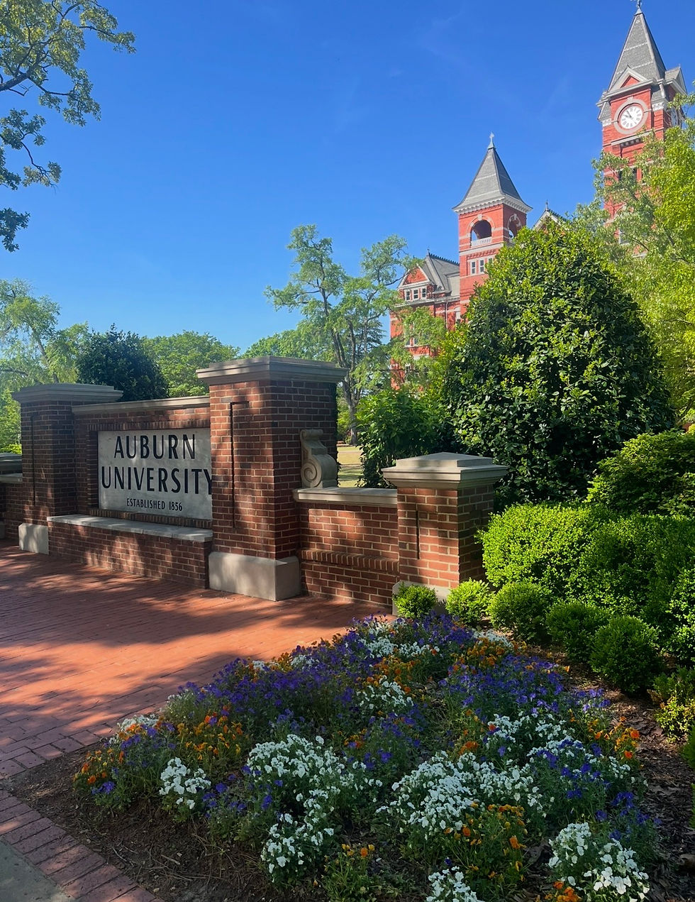 A sign for Auburn University in front of Samford Hall.