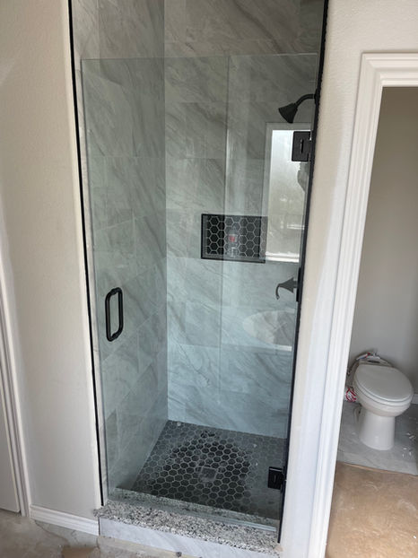 frameless shower door, matte black hardware
