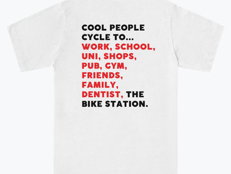 The Bike station's limited edition t-shirt with text reading 'Cool people cycle to...work, school, uni, shops, pub, gym, friends, family, dentist, The Bike Station.