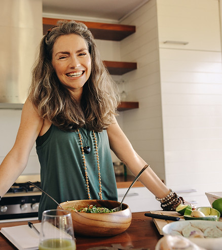 Happy woman transitioning through menopause with coaching