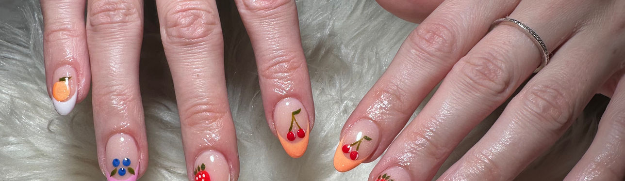 Trendy minimalist nail art design with colorful playful accents on short natural nails at 312 Nails & Spa River North Chicago.