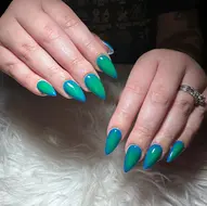 Almond acrylic nail extensions with a bright green base and peach airbrush aura effect, done at 312 Nails & Spa salon in River North, Downtown Chicago.