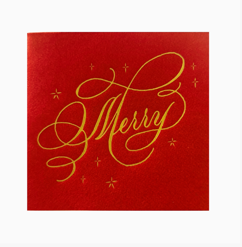 Red Very Merry script napkin with gold calligraphy.
