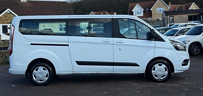 White 8 seater vehicle