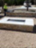Residential concrete contractor stone ourdoor fire pit with concrete caps in Boerne, TX
