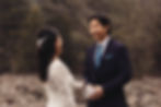 Groom smiling at bride