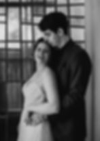 Elopement couple by a window