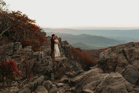 Bride and groom at the Hawksbill Overlook in Shenandoah National Park at sunset