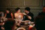 elopement couple doing cheers at dinner