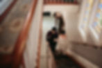 couple climbing steps at the Rathbone mansions