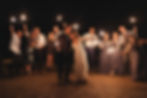 bride and groom with guests and sparklers