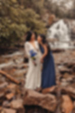 bride and maid of honor laughing