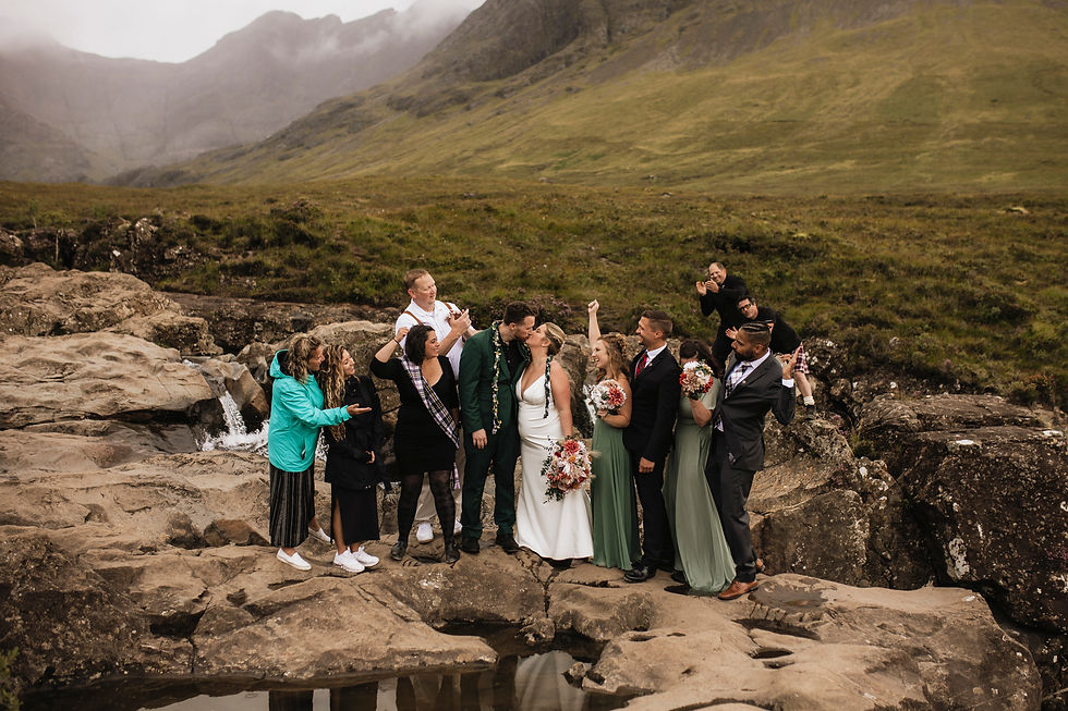 Elopement couple and guests at the Fairy Pools on the Isle of Skye in Scotland