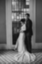 elopement couple by a stained glass window