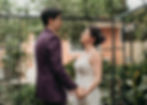 bride and groom in a court yard garden in New Orleans