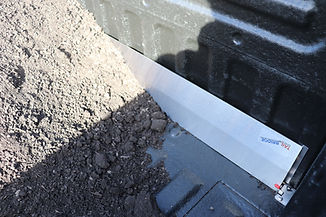 The tail BRidge system in the up position with dirt against it