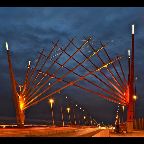 Illuminated Bob Kerrey Pedestrian Bridge at night.