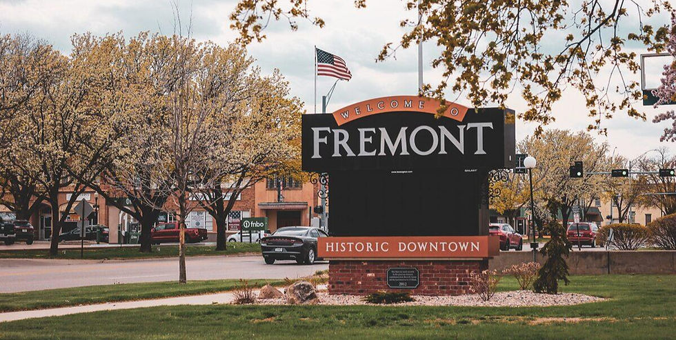 Historic Downtown Fremont, Nebraska sign with American flag.