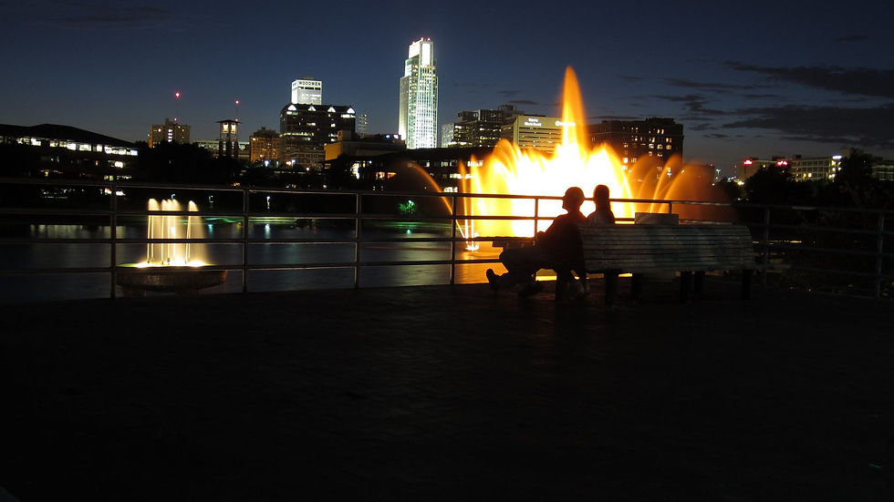 Couple sitting on a bench at Heartland of America Park.