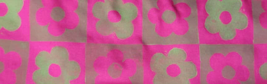 Retro floral checkered pattern in a vibrant oink and green.