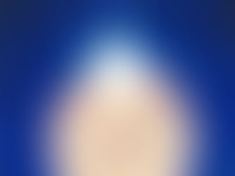 A person floats in a glowing sphere against a deep blue background, reaching toward a bright white burst above, creating a surreal, dreamy mood.