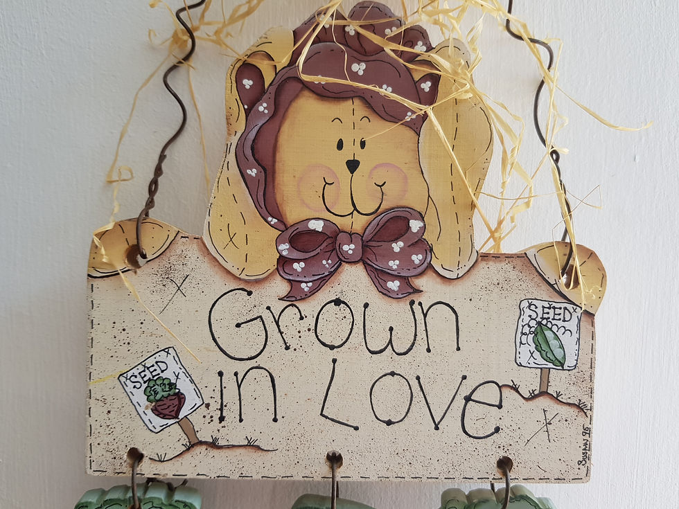 תמונה ממוזערת: שלט עץ: גדלים באהבה