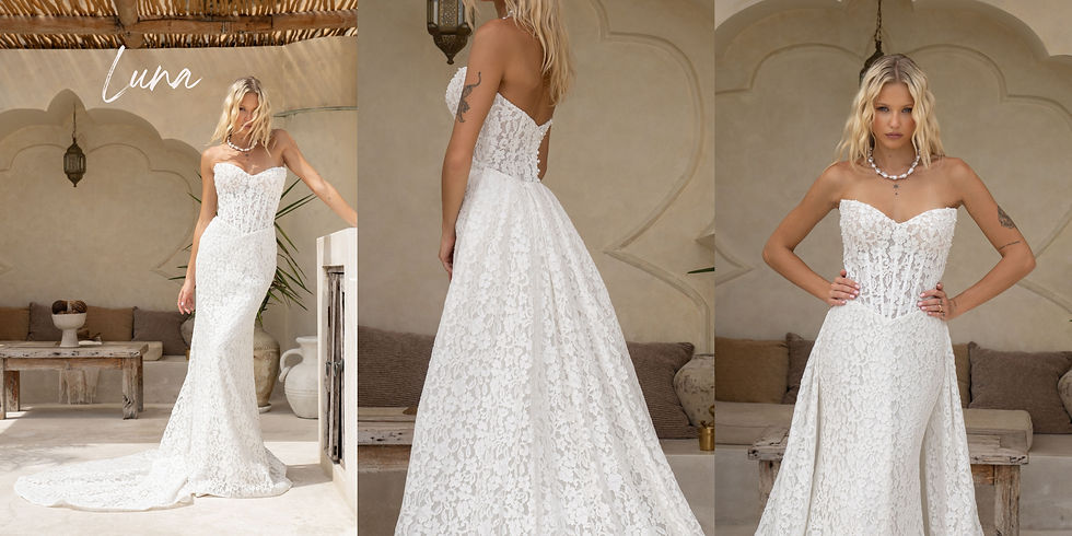 Woman in Luna - white lace gown poses on a patio, sunlight streaming in. Bridal gowns at Manchester bridal shop The Corner Atelier.