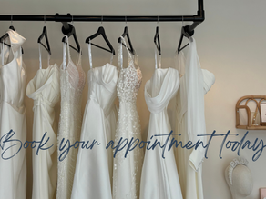 Inside of bridal boutique showcasing a rail of dresses with text encouraging brides to 'Book your wedding dress appointment at The Corner Atelier, Manchester'.