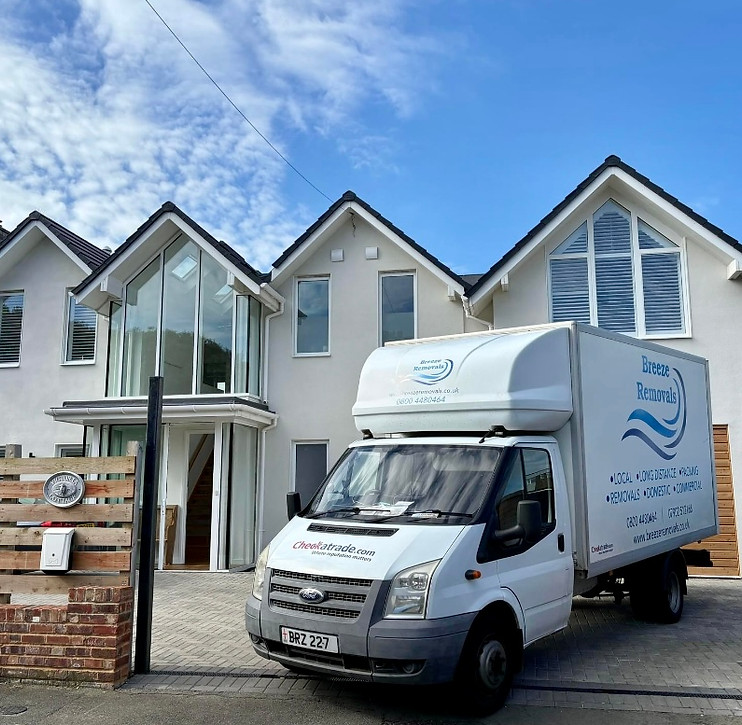 Breeze Removal van parked outside house