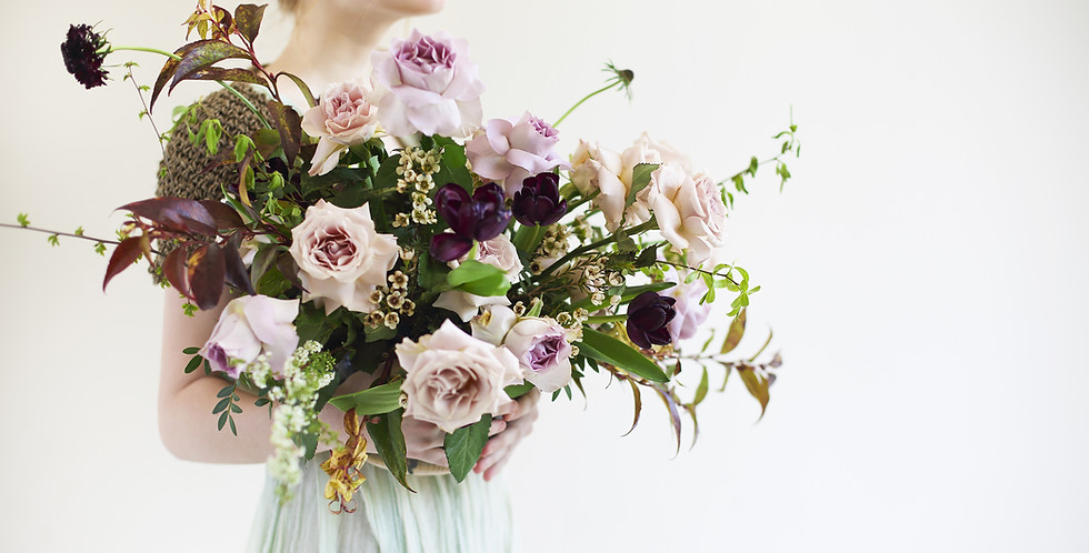 Unusual wedding stylish bouquet with pink and violet flowers in hands of a bride .jpg