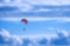 person%20in%20red%20parachute%20under%20white%20clouds%20during%20daytime_edited.jpg