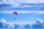 person%20in%20red%20parachute%20under%20white%20clouds%20during%20daytime_edited.jpg